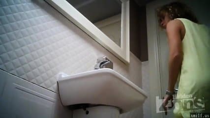 Spying on a girl with a shaved pussy and pink anus. by